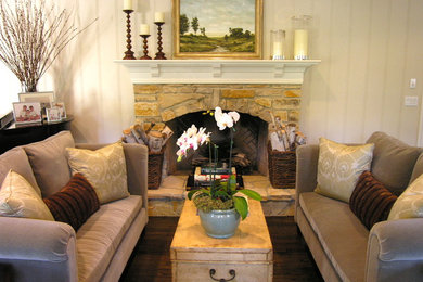 Mid-sized elegant formal and enclosed dark wood floor and brown floor living room photo in Los Angeles with gray walls, a standard fireplace, a stone fireplace and no tv