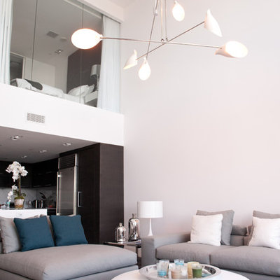 Example of a small trendy formal and open concept living room design in Miami with white walls, no fireplace and no tv