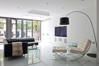 Photo of a medium sized contemporary formal enclosed living room in London with white walls, porcelain flooring and a built-in media unit.