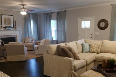 Example of a mid-sized transitional open concept living room design in Birmingham with gray walls