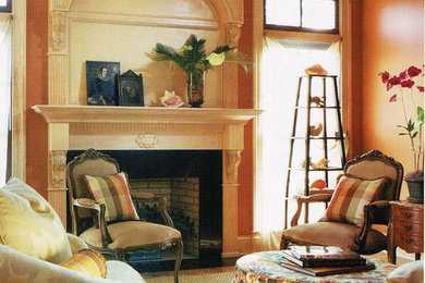 Inspiration for an eclectic living room remodel in Indianapolis with a standard fireplace and a wood fireplace surround