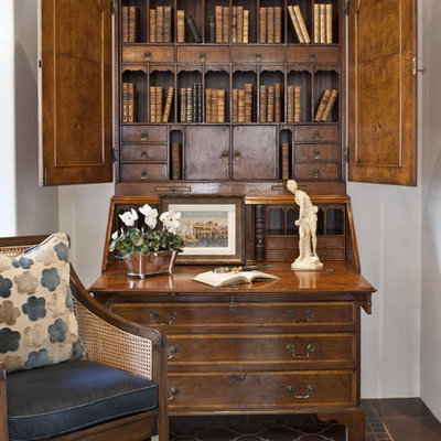 Tuscan enclosed ceramic tile and brown floor living room library photo in Los Angeles with white walls, no fireplace and no tv