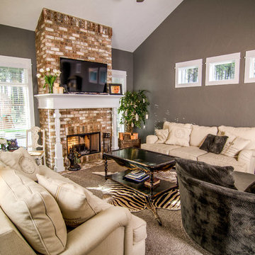 Living Room - Brick Fireplace with wood wrapped mantle