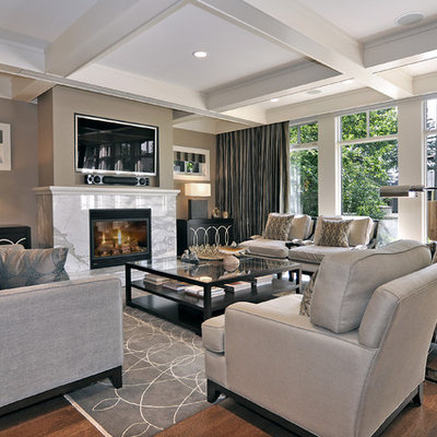 Inspiration for a transitional medium tone wood floor and brown floor living room remodel in Calgary with a stone fireplace, beige walls and a wall-mounted tv