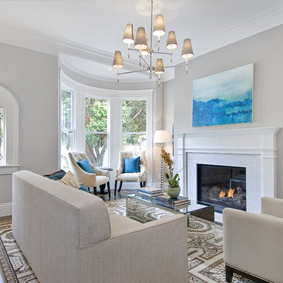 Living room - traditional living room idea in San Francisco with gray walls and a standard fireplace