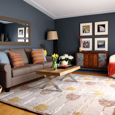 Mid-sized trendy medium tone wood floor living room photo in Toronto with blue walls