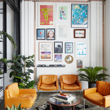 LIVING ROOM | Concrete Flooring, Vintage Armchairs & Gallery Wall