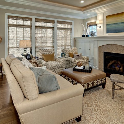 Example of a mid-sized classic formal and enclosed dark wood floor living room design in Minneapolis with beige walls, a standard fireplace, no tv and a wood fireplace surround