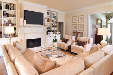 Photo of a medium sized contemporary formal living room in New Orleans with beige walls, carpet, a standard fireplace, a stone fireplace surround and a wall mounted tv.