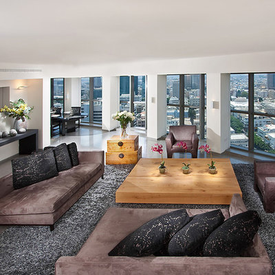 Example of a huge trendy living room design in Other with white walls