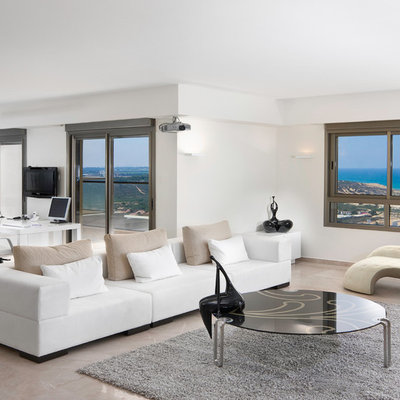 Inspiration for a contemporary open concept beige floor living room remodel in Other with white walls