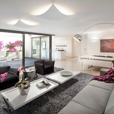 Example of a trendy open concept living room design in Other with white walls