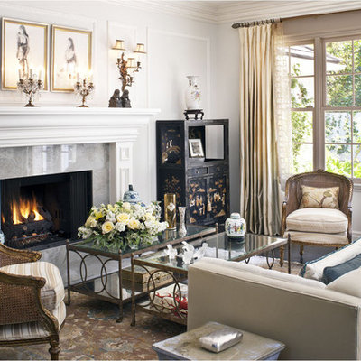 Mid-sized elegant formal and enclosed dark wood floor and brown floor living room photo in Los Angeles with gray walls, a standard fireplace and no tv