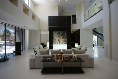 Inspiration for a contemporary formal and open concept living room remodel in Miami with beige walls