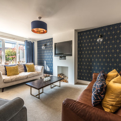 Living room - mid-sized contemporary enclosed carpeted and beige floor living room idea in Devon with white walls and a wall-mounted tv
