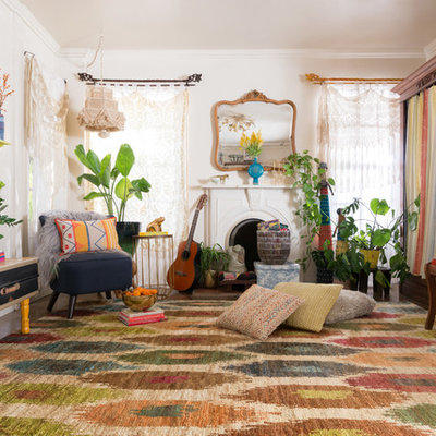 Example of an eclectic dark wood floor living room design in Dallas with white walls