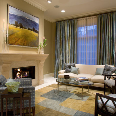 Example of a classic living room design in Chicago with beige walls and a standard fireplace
