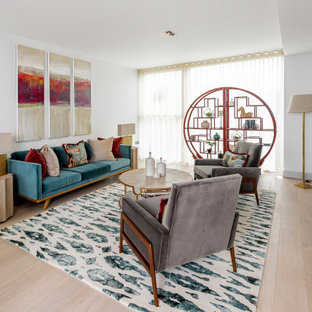 Design ideas for a contemporary formal living room in Wiltshire with white walls, light hardwood flooring, no fireplace, no tv and beige floors.
