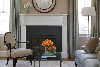 ワシントンD.C.にある高級な中くらいなトランジショナルスタイルのおしゃれなリビングロフト (ベージュの壁、無垢フローリング、標準型暖炉、石材の暖炉まわり) の写真