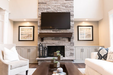 Living Room Remodel Featuring a Ledgestone Fireplace + Cabinetry + Shaw Coretec