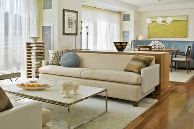 Inspiration for a modern living room in Boston with white walls.