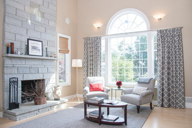 Example of a mid-sized transitional formal and loft-style light wood floor living room design in Boston with beige walls, a standard fireplace, a stone fireplace and no tv