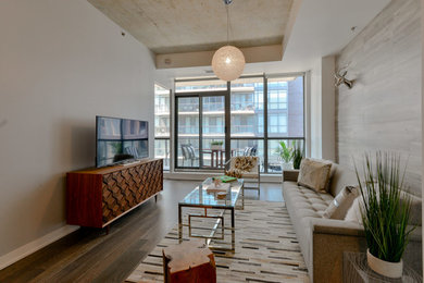 Living room - coastal light wood floor living room idea in Toronto with gray walls