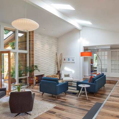 Living room - large 1960s open concept living room idea in Portland with white walls, a metal fireplace and a ribbon fireplace