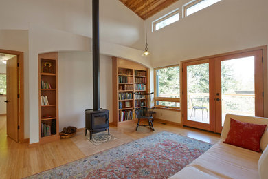 Bamboo floor living room photo in Other with a wood stove