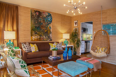 Inspiration for an eclectic enclosed medium tone wood floor living room remodel in Los Angeles with beige walls