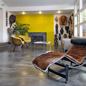Living room with bright yellow fireplace