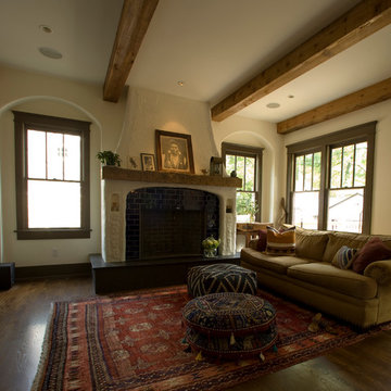 Living Room with Exposed Beams and Poufs