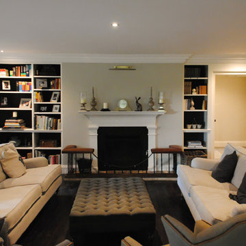 Living room with fitted cupboards and fireplace