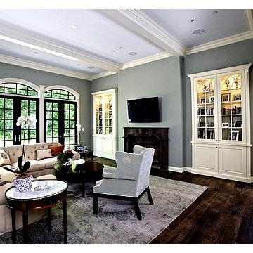 Living Room with Painted White Raised Panel Cabinetry, Beams and Millwork