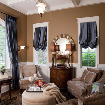 Living Room with Roman Shades, White Wainscoting and Demi-Lune Chest