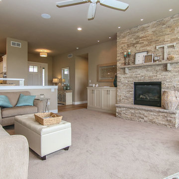 Living room with stone fireplace and built ins