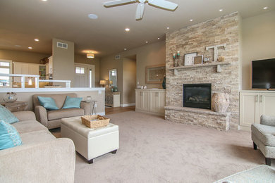 Living room with stone fireplace and built ins