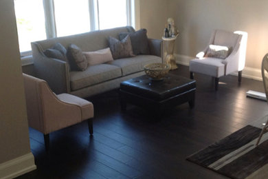Living room - dark wood floor living room idea in Toronto with beige walls