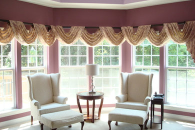 Medium sized vintage formal enclosed living room in Charlotte with purple walls, carpet, no fireplace and no tv.