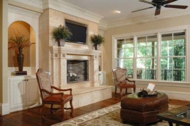 Mid-sized formal and enclosed dark wood floor living room photo in Cincinnati with beige walls, a standard fireplace, a stone fireplace and a wall-mounted tv