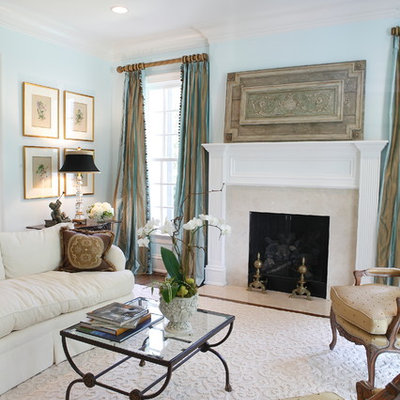 Living room - traditional formal living room idea in Raleigh with blue walls, a standard fireplace and no tv