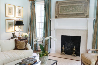 Living room - traditional formal living room idea in Raleigh with blue walls, a standard fireplace and no tv