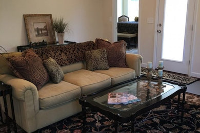 This is an example of a small traditional formal enclosed living room in Orange County with beige walls, porcelain flooring, no fireplace, no tv and grey floors.