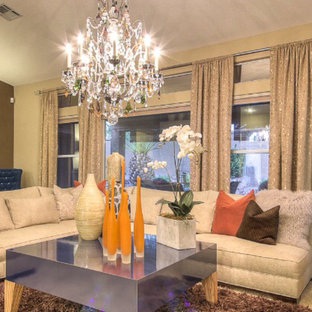 Living room - eclectic formal and enclosed carpeted living room idea in Las Vegas with beige walls, a standard fireplace and a tile fireplace