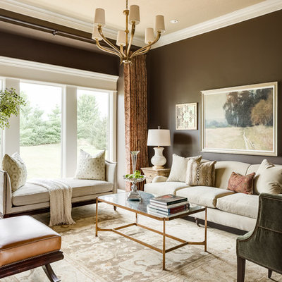 Example of a mid-sized classic formal and enclosed medium tone wood floor living room design in Kansas City with brown walls, no fireplace and no tv