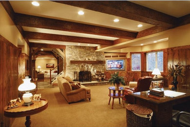 Large rustic enclosed living room in Cleveland with beige walls, carpet, a standard fireplace, a stone fireplace surround and a built-in media unit.