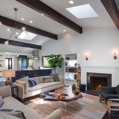 Living room - huge contemporary open concept dark wood floor and brown floor living room idea in Los Angeles with white walls, a standard fireplace, a tile fireplace and no tv
