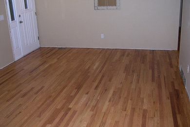 Living room - medium tone wood floor living room idea in Cleveland