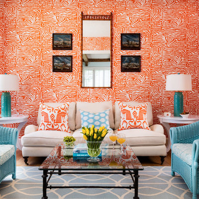 Large island style formal and enclosed light wood floor and beige floor living room photo in Miami with orange walls, no fireplace and no tv