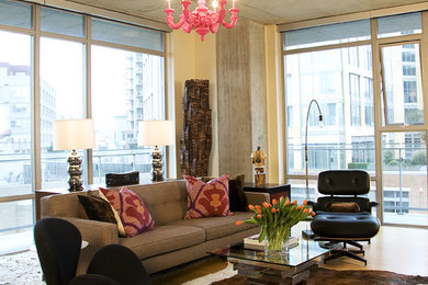 Example of an urban open concept living room design in Seattle with beige walls